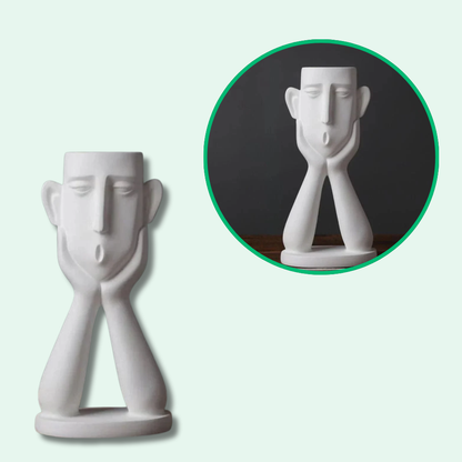 Vaso de flores com rostos artísticos elegantes